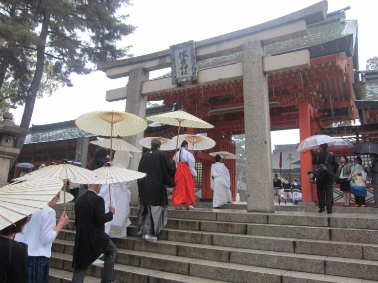 A wedding procession entering the central courtyard