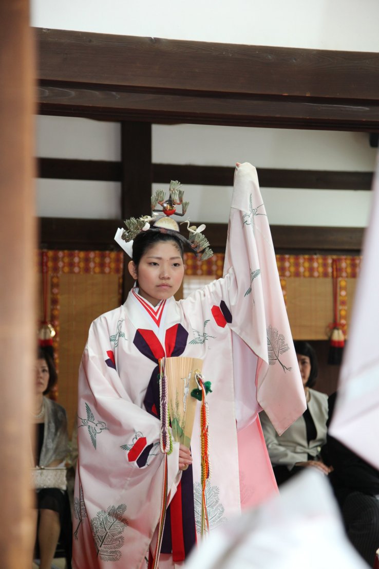 A Miko (Shrine Maiden) performing a dance 