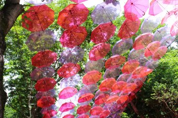 Metsa is a Finnish theme park comprising Moominvalley Park and Metsa Village. Moominvalley Park is charged, but the Metsa village has no entry fee. In summer the umbrella sky colors the entrance road to the village. Thousands come to see the free umbrella art project.