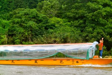 Boats cruise up and down the river.