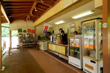 The boat stops briefly so passengers can buy drinks, rice-flavoured ice cream or whole fish roasted on sticks.