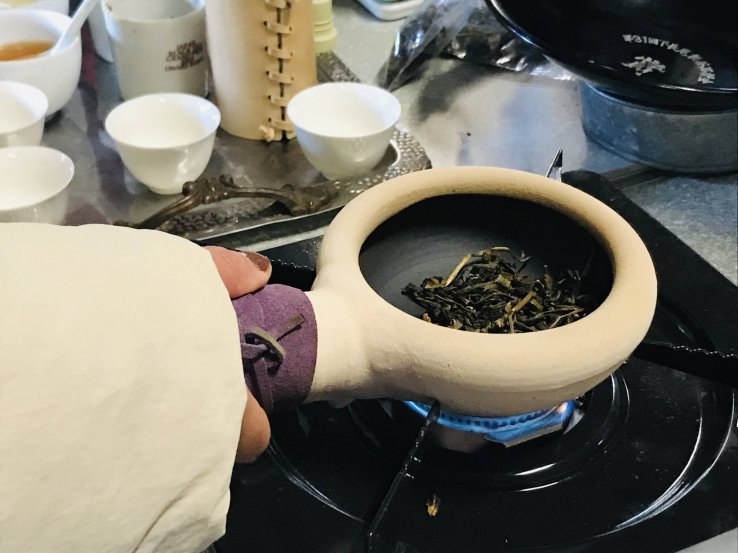 Roasting the tea in the ceramic pot