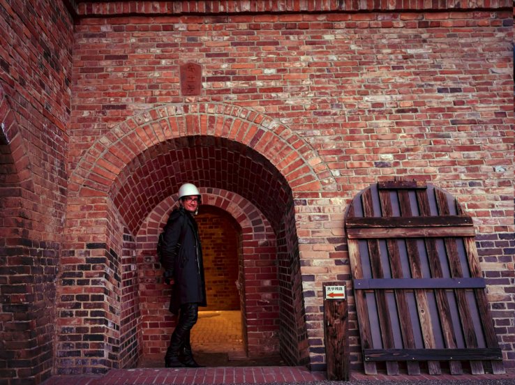 Heading inside on a tour. English signs and a comprehensive pamphlet are available.