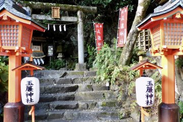 A historic shrine looks down on the hotel garden.