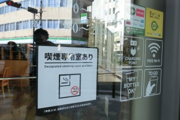 "Designated smoking room" mark outside a coffee shop in Yokohama City.