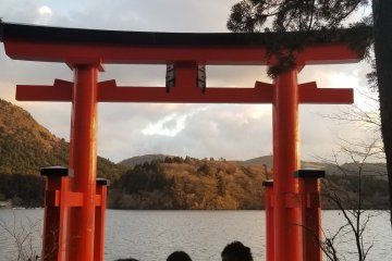 People waiting in line to take a picture with the tori gate