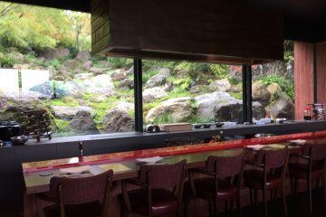 Counter seats and rock garden view through the window