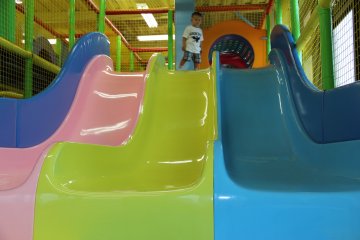 <p>There are multi-colored slides all over Mihama Kid's Park</p>