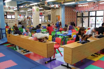 <p>A large seating area in the middle of Mihama Kid's Park gives parents a great vantage point to relax at while keeping an eye on their active children running about the park</p>