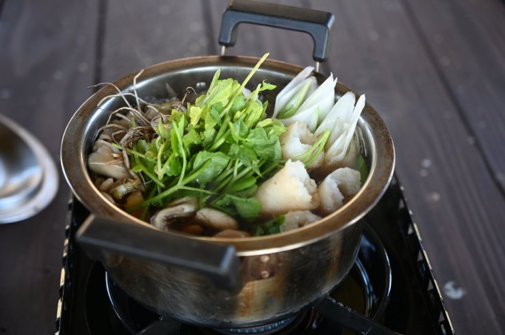 Nabekko hot pot with kiritanpo simmering alongside the veggies