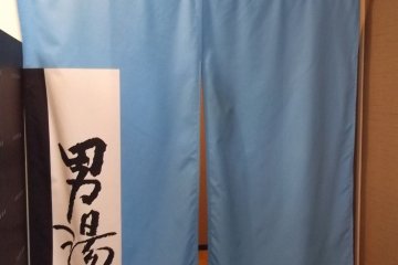 A blue curtain for the mens' spa
