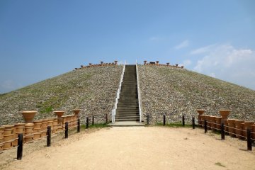 <p>The raised mound is the head of the keyhole tomb</p>