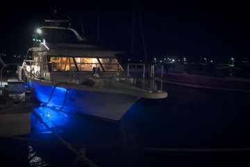 <p>The night-cruising boat glows with blue LEDs underneath</p>