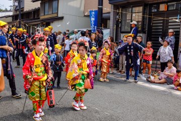 Children are dressed in beautiful colourful dress and enthusiastically take part in the 300 year old festival