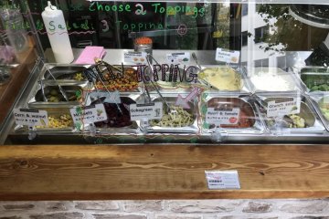 There are numerous salad and sauce options to fill your falafel sandwich with