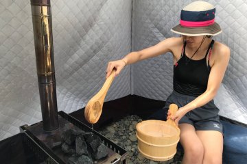 Pour water on the hot stones, if you like it hotter and very hot