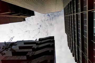 The shrine is surrounded by tall buildings