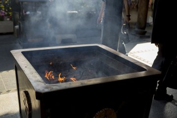 Offerings of incense fill the air with a sweet smoke at Isshinji Tennoji