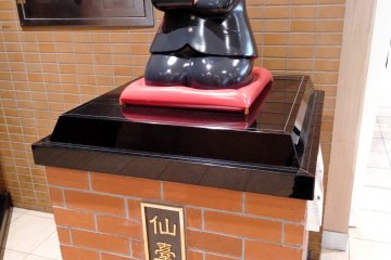 Sendai's lucky god is outside the station office on the first floor.