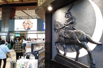The NewDays convenience stores in the center of the station feature Date Masamune motifs.