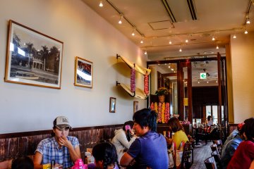 <p>The restaurant is filled with Hawaiian paraphranalia like surfboards, lei necklaces and surfing photos</p>