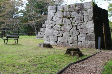 A stone tower foundation marks the site of a now-gone castle gate