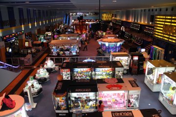 <p>The cavernous arcade on the first floor is full of skill cranes, photo booths, video games and other skill games</p>