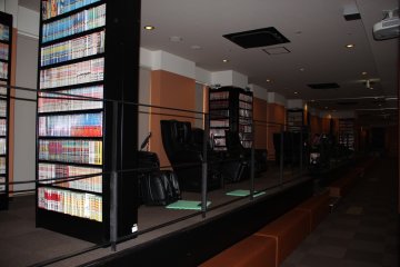 <p>The fourth floor comic and relaxation area features massage chairs and manga books all overlooking the bowling alley on the third floor</p>