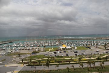<p>The Ginowan City Marina and the China Sea can be seen across the Route 58 bypass from Round 1</p>