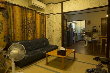 The common room has several areas to sit and talk with other guests