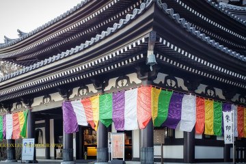 Main hall adorned with Buddhist banners.