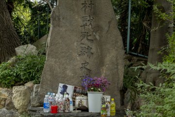 Offerings made to what I believe is the final resting place of Sanada Yukimura who was nicknamed "Crimson Demon of War"