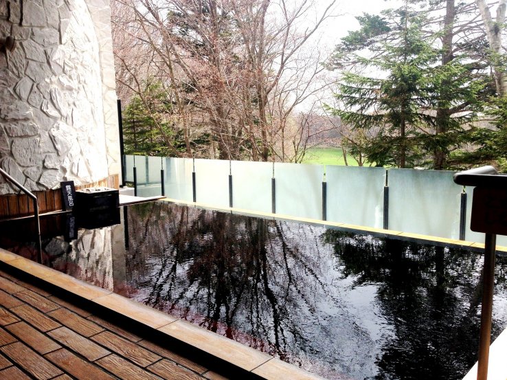 An outdoor bath is a great way to relax at Kitahiroshima Classe Hotel