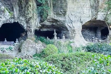 Caves carved into the hillside with urns containing the remains of the departed