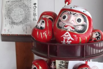 Darumas resting on their stand