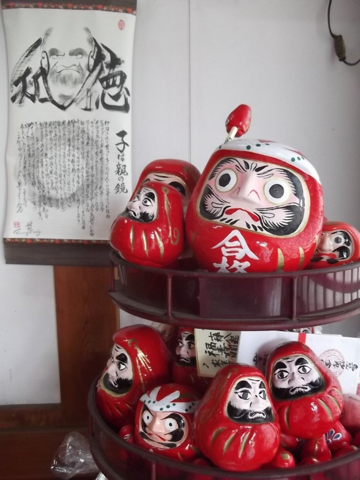 Darumas resting on their stand