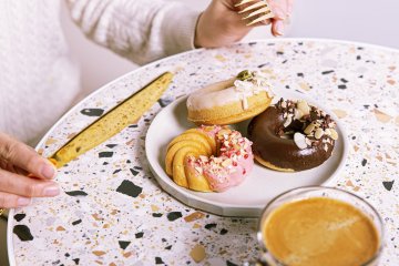The donuts at Nayamachi are decorated with natural toppings like cacao nibs and shredded coconut