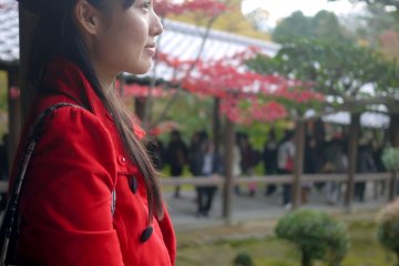 A moment of reflection in the bustling temple.