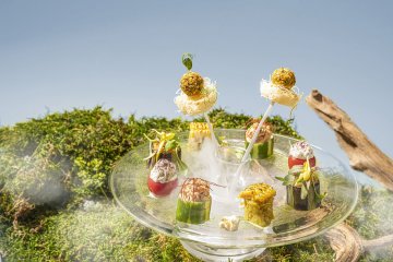 Dry ice creates a mist around the savory plate to emulate the sky
