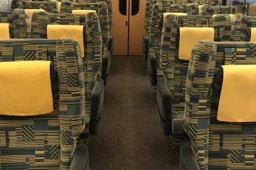 The green car has a 2+2 configuration rather than the 3+2 in most regular cars