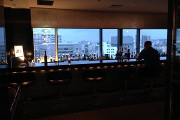 Watching the city at the rooftop bar