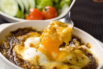 Curry topped with melted cheese is a local specialty