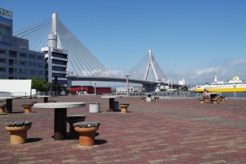 Sit with a drink or snack and a view of the graceful harbor bridge