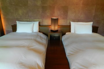Luxurious beds on raised platforms.