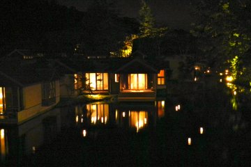 The lanterns on the river at night.