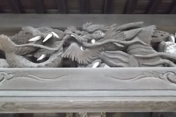 Some buildings have striking dragons carved under the eaves