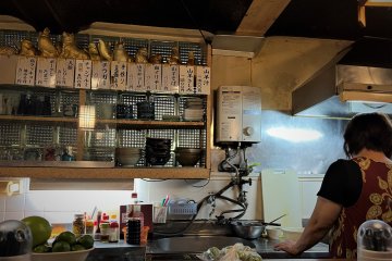 More like an old kitchen than a restaurant, the bottles of awamori are stacked one on top of another, as if you are visiting someone who has hoarded every bottle they ever drunk
