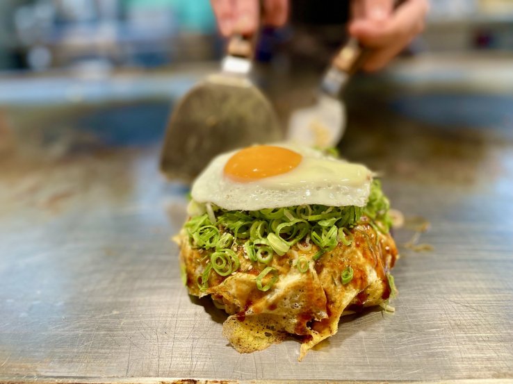 Freshly prepared okonomiyaki