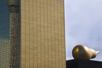 Asahi Beer Azumabashi Hall "Flaming ornament" or "Golden Turd" & reflection of Tokyo Skytree