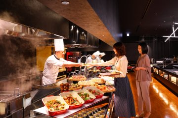 GROTTO's chefs at work preparing and serving dishes